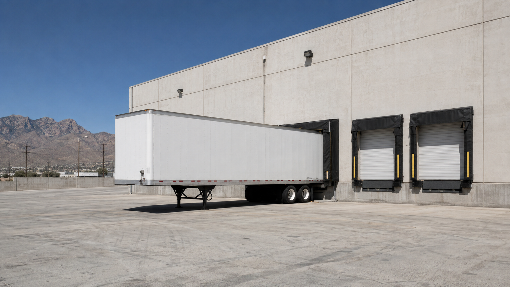 Generic unbranded warehouse dock in an El Paso industrial landscape